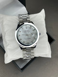 Rolex (Oyster Perpetual) - Date | Silver Dial | Silver chain