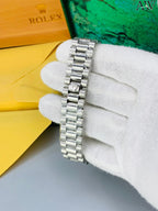 Rolex with date, signature crown and secure Master-lock clasp. ⌚✨