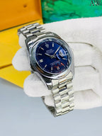 Rolex with date, signature crown and secure Master-lock clasp. ⌚✨